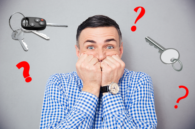 Man with a worried expression surrounded by keys and question marks on a gray background